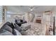 Open-concept living room with tile floors, neutral walls, and seamless access to the kitchen at 3049 Echoed Rondel Ln, Henderson, NV 89044