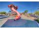 View of a playful community playground with a tower and orange slide at 3049 Echoed Rondel Ln, Henderson, NV 89044