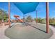 The community playground offers a tower with slide, climbing sphere, and shaded benches at 3049 Echoed Rondel Ln, Henderson, NV 89044
