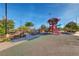 A colorful playground with unique play structure and rock climbing at 3049 Echoed Rondel Ln, Henderson, NV 89044