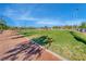 Manicured volleyball field surrounded by lush greenery on a sunny day, offering a vibrant recreational space at 3049 Echoed Rondel Ln, Henderson, NV 89044