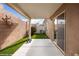 Covered back patio area with artificial turf and brick walls for privacy at 344 Tuscany Cir, Mesquite, NV 89027