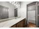 Bathroom boasts a single sink vanity with marble countertops and a shower and tub combo at 344 Tuscany Cir, Mesquite, NV 89027