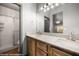 Bathroom boasts a double sink vanity with marble countertops and a walk-in shower with glass door at 344 Tuscany Cir, Mesquite, NV 89027