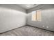 Minimalist bedroom featuring gray carpet and lots of natural light at 344 Tuscany Cir, Mesquite, NV 89027