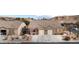 Eye-level shot of a house with a tile roof, front yard, and two-car garage at 344 Tuscany Cir, Mesquite, NV 89027