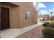 Exterior view of front entrance with brown door, sidewalk, and landscaping at 344 Tuscany Cir, Mesquite, NV 89027