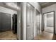 Hallway with tile floors, neutral paint, and laundry area with washer and dryer at 344 Tuscany Cir, Mesquite, NV 89027