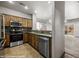 View of a kitchen featuring stainless appliances, wood cabinets, and stone countertops at 344 Tuscany Cir, Mesquite, NV 89027
