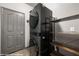 Cozy laundry room features a stacked washer and dryer, shelving and closet at 344 Tuscany Cir, Mesquite, NV 89027