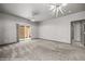Living room featuring a sliding glass doors leading to the patio and carpet floors at 344 Tuscany Cir, Mesquite, NV 89027
