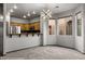 Open living room with carpet flooring and a view of the kitchen at 344 Tuscany Cir, Mesquite, NV 89027