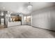 Spacious living room with carpet flooring and a view of the kitchen at 344 Tuscany Cir, Mesquite, NV 89027