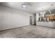 Open living room with carpet flooring and grey walls looking to the kitchen at 344 Tuscany Cir, Mesquite, NV 89027