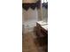 This bathroom includes a vanity, and soaking tub with a window for natural lighting at 3615 Hardwick Hall Way, Las Vegas, NV 89135