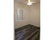 A cozy bedroom featuring modern dark wood floors and a ceiling fan for added comfort at 3615 Hardwick Hall Way, Las Vegas, NV 89135