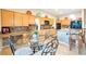 Cozy breakfast nook with wooden cabinets, granite countertops, and views of the kitchen appliances at 3615 Hardwick Hall Way, Las Vegas, NV 89135