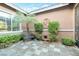 Private courtyard features a bench, mature landscaping, and a tile floor at 3615 Hardwick Hall Way, Las Vegas, NV 89135