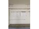 Garage with overhead storage racks and built-in cabinets at 3615 Hardwick Hall Way, Las Vegas, NV 89135