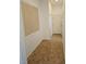 Hallway with tile flooring and natural light from a nearby window at 3615 Hardwick Hall Way, Las Vegas, NV 89135