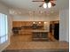 Spacious kitchen featuring wooden cabinets, granite countertops, and a central island with pendant lighting at 3615 Hardwick Hall Way, Las Vegas, NV 89135