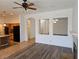 Living room featuring a fireplace and archways to the dining area and kitchen at 3615 Hardwick Hall Way, Las Vegas, NV 89135