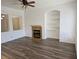 Spacious living room featuring a fireplace and built-in shelves at 3615 Hardwick Hall Way, Las Vegas, NV 89135