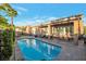 Backyard oasis with a sparkling pool and a covered patio for outdoor dining at 3615 Hardwick Hall Way, Las Vegas, NV 89135