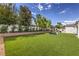 Well-manicured backyard offers ample space for recreation, including an oversized chess set and lounge area at 3731 Caesars Cir, Las Vegas, NV 89120