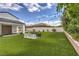 Expansive backyard featuring a manicured lawn and a unique, oversized chess set, ideal for outdoor recreation at 3731 Caesars Cir, Las Vegas, NV 89120
