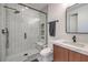 Modern bathroom featuring a tiled walk-in shower, sleek fixtures, and a stylish vanity with ample counter space at 3731 Caesars Cir, Las Vegas, NV 89120