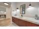 Modern bathroom featuring sleek vanity with quartz countertop and stylish black fixtures at 3731 Caesars Cir, Las Vegas, NV 89120