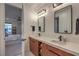 Elegant bathroom with dual sinks, quartz countertops, and contemporary fixtures at 3731 Caesars Cir, Las Vegas, NV 89120