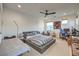 A spacious bedroom with a bed, a seating area, and a desk for a perfect blend of relaxation and productivity at 3731 Caesars Cir, Las Vegas, NV 89120