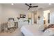 This well-lit bedroom features neutral tones, a modern ceiling fan and includes a dedicated workspace at 3731 Caesars Cir, Las Vegas, NV 89120
