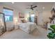 Bright bedroom featuring a ceiling fan, white walls, and ample natural light for a welcoming and airy ambiance at 3731 Caesars Cir, Las Vegas, NV 89120