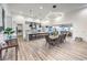 Open concept dining room and kitchen area with wood floors and lots of natural light at 3731 Caesars Cir, Las Vegas, NV 89120