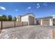 Spacious driveway with a modern fence and access to a three-car garage, providing ample parking at 3731 Caesars Cir, Las Vegas, NV 89120