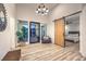 Modern entryway features wood flooring, a large picture window, and sliding barn door at 3731 Caesars Cir, Las Vegas, NV 89120