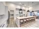 Bright modern kitchen with a large island features seating, white cabinets, and stainless appliances at 3731 Caesars Cir, Las Vegas, NV 89120