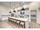 Bright modern kitchen features a large island with seating, white cabinets, and modern appliances at 3731 Caesars Cir, Las Vegas, NV 89120