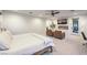 Spacious main bedroom featuring a king-sized bed, fireplace, seating area, and ample natural light at 3731 Caesars Cir, Las Vegas, NV 89120