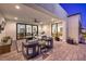 Inviting outdoor patio area with comfortable seating, elegant decor, and seamless access to the lush backyard at 3731 Caesars Cir, Las Vegas, NV 89120