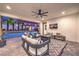 Stylish outdoor living area with cozy seating, a modern ceiling fan, and a view of the sparkling swimming pool at 3731 Caesars Cir, Las Vegas, NV 89120