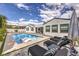 Luxury pool featuring in-pool loungers and a patio with lounge chairs, creating an ideal outdoor oasis at 3731 Caesars Cir, Las Vegas, NV 89120