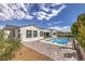 Resort-style backyard with a sparkling pool, lounge chairs, and lush landscaping, perfect for relaxation and entertaining at 3731 Caesars Cir, Las Vegas, NV 89120