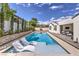 Beautiful pool area with modern lounge chairs and lush landscaping, perfect for relaxation and recreation at 3731 Caesars Cir, Las Vegas, NV 89120