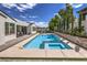 Large rectangular pool with spa, perfect for relaxing and entertaining in a beautifully landscaped backyard at 3731 Caesars Cir, Las Vegas, NV 89120