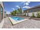 Spacious pool with a built-in spa and ample patio space, perfect for outdoor entertaining and relaxation at 3731 Caesars Cir, Las Vegas, NV 89120