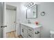 Bright bathroom with a stylish vanity, modern fixtures, and updated with a framed mirror at 3790 Shirebrook Dr # 167, Las Vegas, NV 89115
